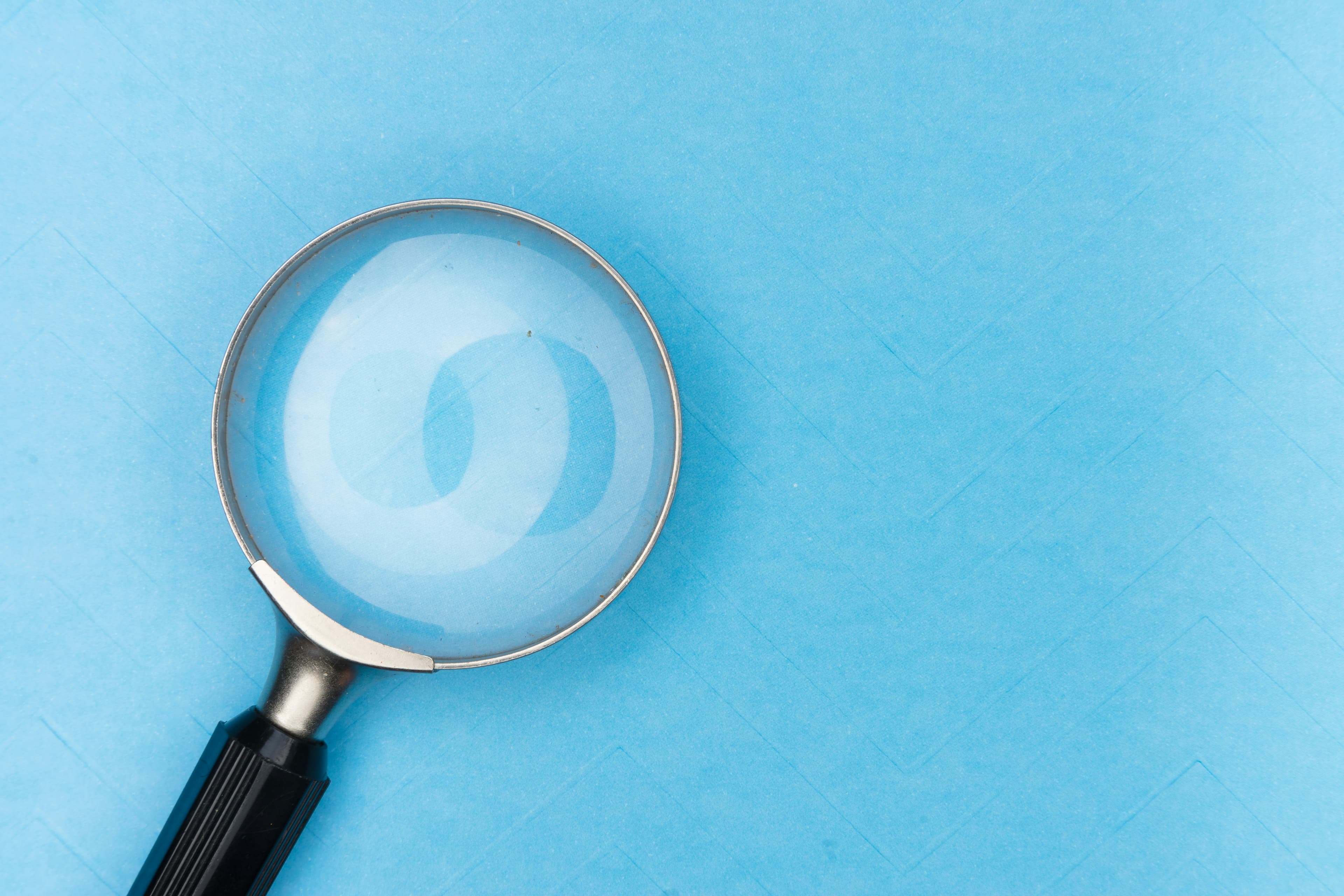 Professional magnifying glass symbolizing detailed private investigation